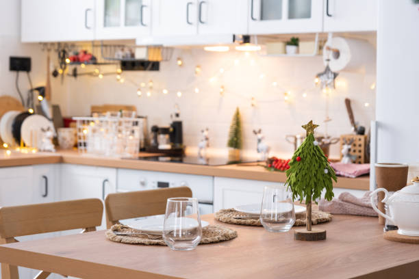istock Festive Christmas decor and mess in the light kitchen, festive breakfast, white scandi interior. New Year, mood, cozy home 1446374191