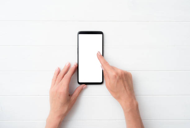 istock Mock up of user hands with black smartphone for your design 1446374947
