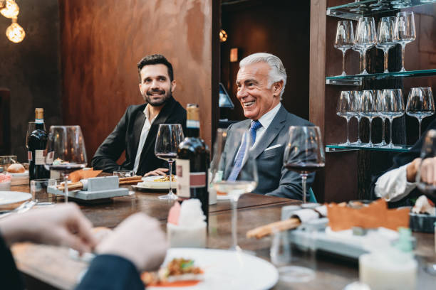 istock Business people are talking together during a dinner at the restaurant 1446375042