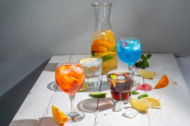 istock Many different cocktails on a light background. Mixology and nightlife concept. Colored alcoholic and non-alcoholic cocktails 1446375715