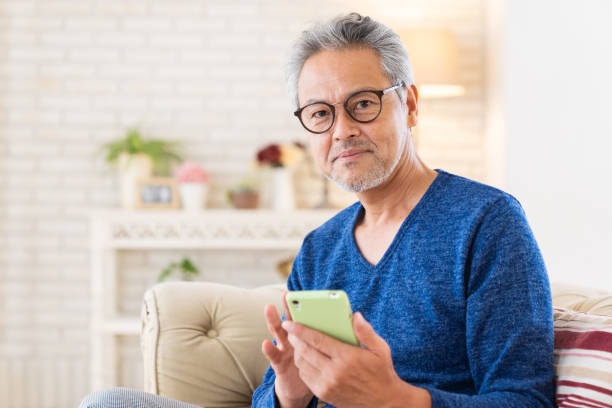 istock elderly man who uses smart phone, 1446377654