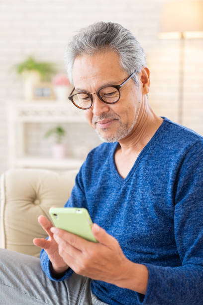 istock elderly man who uses smart phone, 1446377713