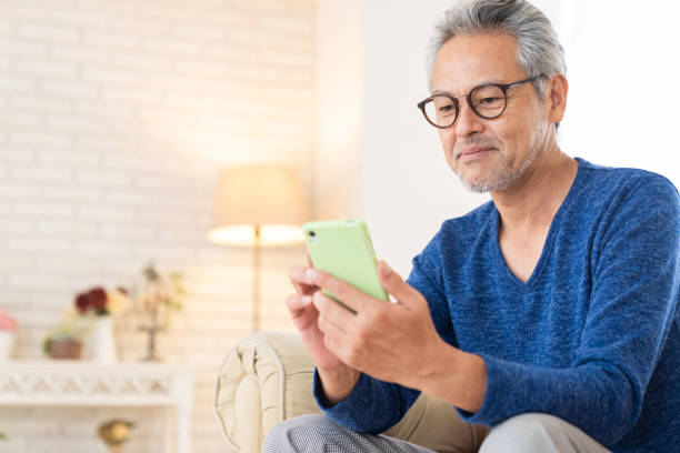 istock elderly man who uses smart phone, 1446377809