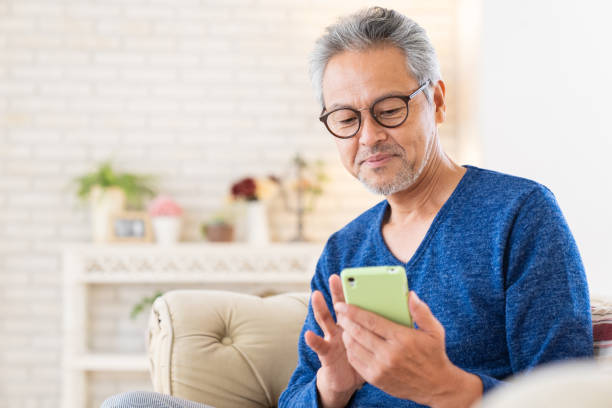 istock elderly man who uses smart phone, 1446377812