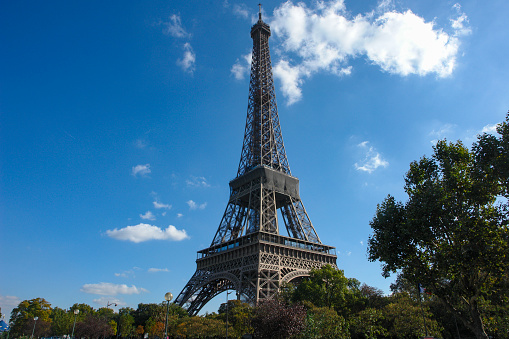 The Eiffel Tower is the iconic landmark of Paris, France. Located in the 7th arrondissement of Paris, northwest of Champ de Mars Park. Built for the Paris Universal Exposition (1889), it takes its name from its designer and builder, Gustave Eiffel.
