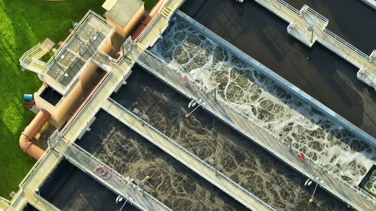 Aerial view of modern water cleaning facility at urban wastewater treatment plant. Purification process of removing undesirable chemicals, suspended solids and gases from contaminated liquid