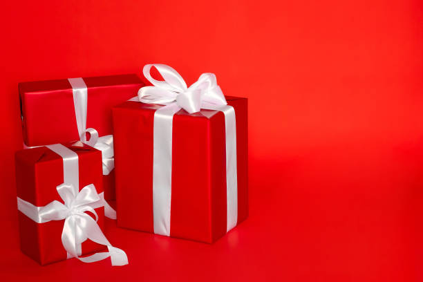 istock Minimal gift wrapping design for birthday or Christmas on a red background 1446384707