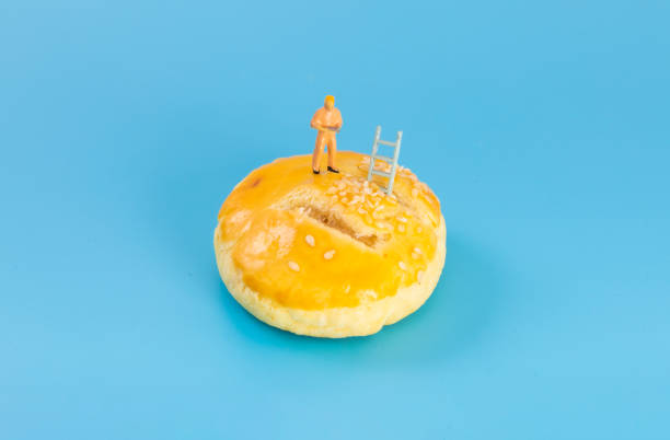 istock The little man standing over the dessert 1446385557