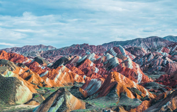 The red earth under the blue sky and white clouds The red earth under the blue sky and white clouds danxia landform stock pictures, royalty-free photos & images