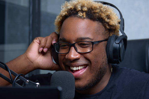 istock African blogger records broadcast while looking laptop screen his home desk 1446387188