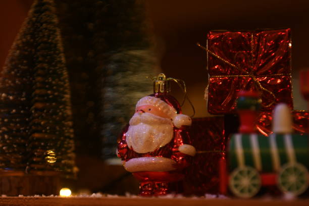 istock Christmas ornaments- Santa Claus, pine tree and wrapped gift. 1446391908