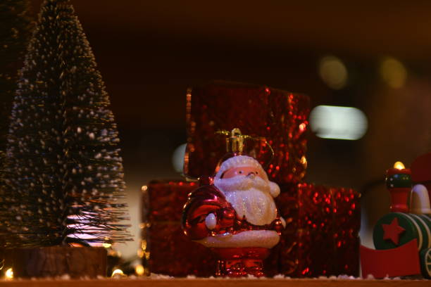 istock Christmas ornaments- Santa Claus, pine tree and wrapped gift. 1446391909