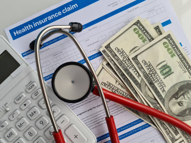 Medical reimbursement with health insurance claim form and stethoscope with money dollars Medical reimbursement with health insurance claim form and stethoscope with money dollars. Health care and modern medicine concept health insurance stock pictures, royalty-free photos & images