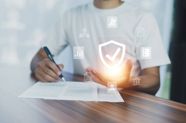 istock Man using  computer buy insurance online at home 1446401199