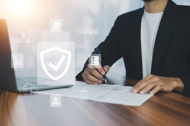 istock Man using  computer buy insurance online at home 1446401220