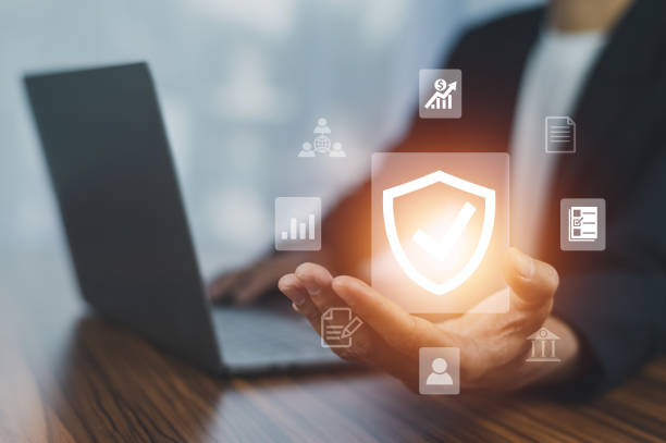 istock Man using  computer buy insurance online at home 1446401240
