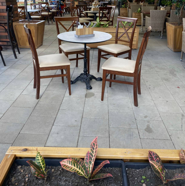 istock Outdoor cafe tables with chairs are in the general interior 1446402389