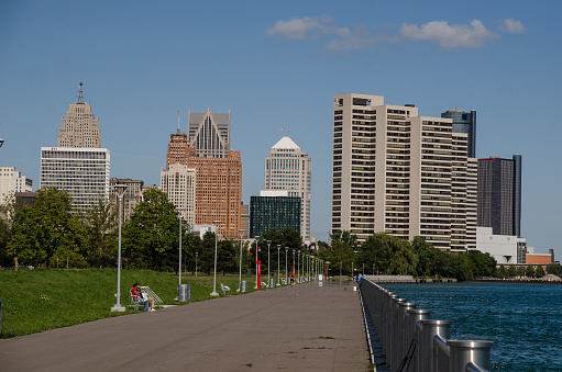 View of Downtown Detroit from West Riverfront Park in Detroit, Michigan on a clear summer day.