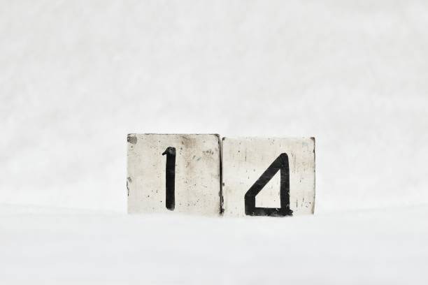 istock Number 14 calendar date number, white mottled winter background copy space 1446404273