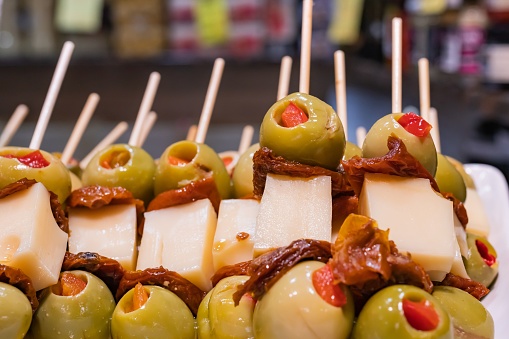 Stuffed olive and cheese brochette, Spanish gastronomy, selective approach right side.