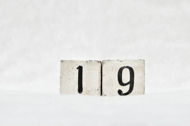 istock 19 calendar date number, white winter background copy space 1446412371