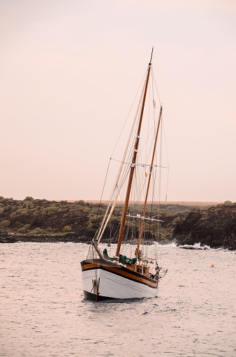 Panoramic view of wooden ship's wheel on the boat at the ocean