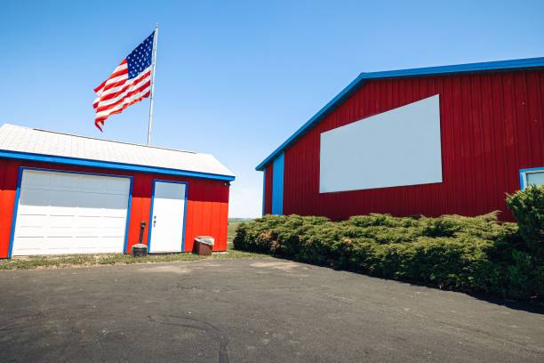 istock Automatic controlled poultry shed with waving American flag on the blue sky 1446414602