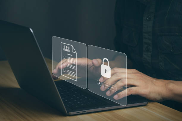 istock Businessmen protecting personal data on laptop and virtual interfaces. 1446415894