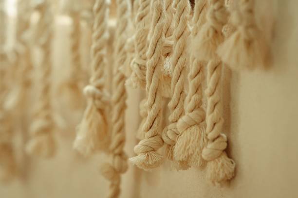 istock Closeup shot of threaded ropes against a wall with a blurry background 1446416002