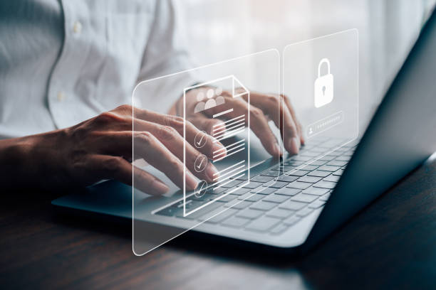 istock Businessmen protecting personal data on laptop and virtual interfaces. 1446416284