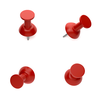 Red push pins On White Background