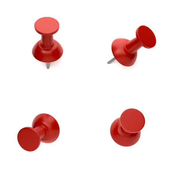 Photo of Red push pins On White Background