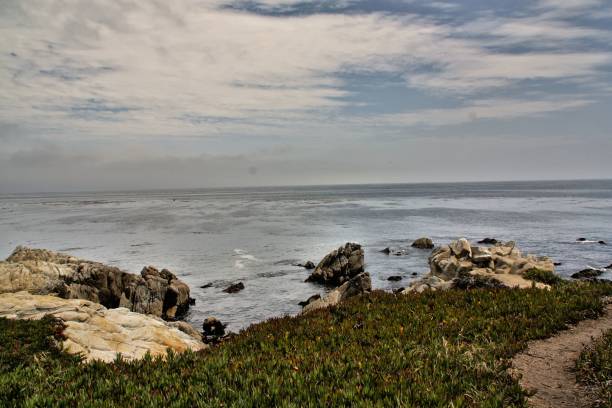 istock Beautiful scenery with a rocky shore and a calm sea 1446417103
