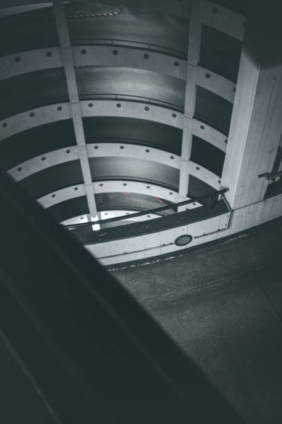 istock Greyscale shot of a spiral road building 1446417498