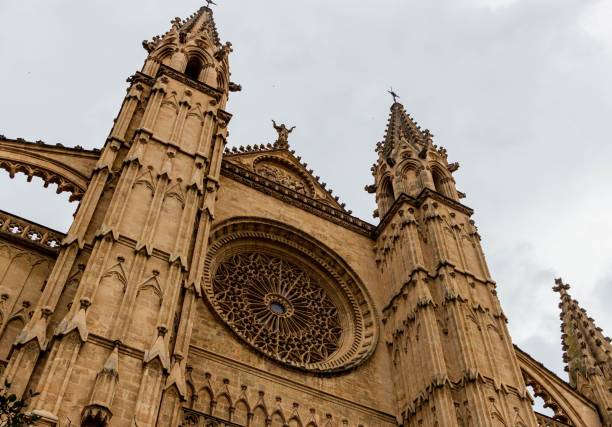 istock Low angle facade view of the gothic Palm Cathedral under the cloudy sky 1446418143