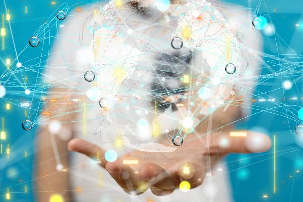 istock Businessman presenting a 3D rendered hologram of a network in a cyberspace 1446419133