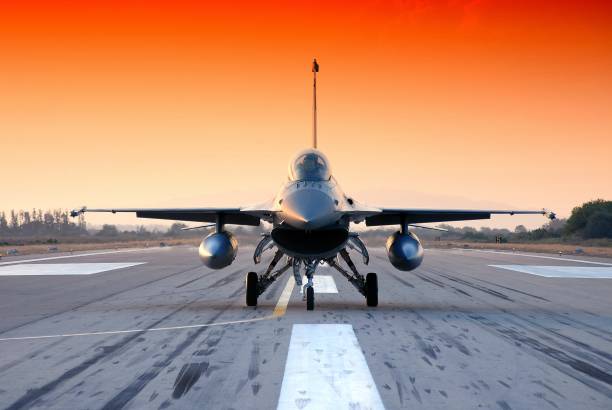 istock Airplane landing on the asphalt runway on the sunset 1446419507