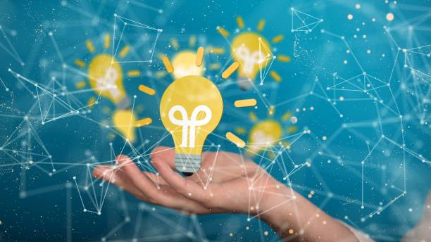 istock Yellow bulb hovering above the person's hand. 1446419717