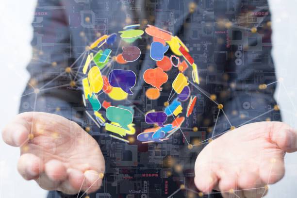 istock 3d rendered colorful speech bubble icons hovering over male hands 1446419733