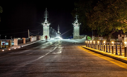Matanzas, Cuba – April 29, 2019: A scenic night shot of bridges with a street and lights in Matanzas
