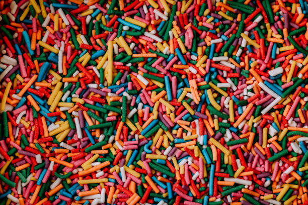 istock Sugar sprinkle dots background. Colorful decoration for cake 1446420984