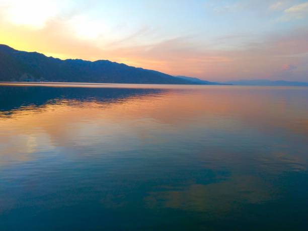 istock Breathtaking sunset behind the mountains over the sea 1446422292