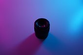 Sony 50mm 1.8 lens with pink and blue lights.