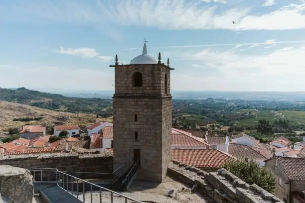 Photo of Ancient tower on a sunny day in Castelo Novo, Portugal