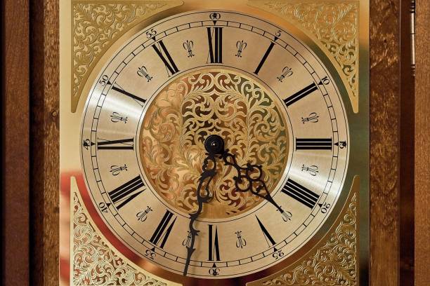 istock Antique golden clock with roman numerals and black hands 1446423334