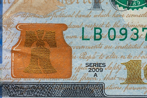 A closeup of a one hundred dollar bill banknote