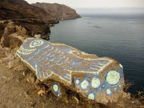 istock Colored draw of big fish on a rock 1446424713