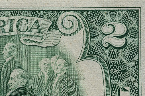 A closeup of a rare two American dollar bill banknote