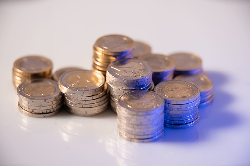 A closeup shot of Euro coins in white background