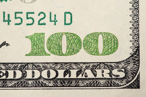 A closeup of a 100 American dollar banknote